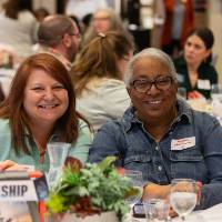 two people posing for photo